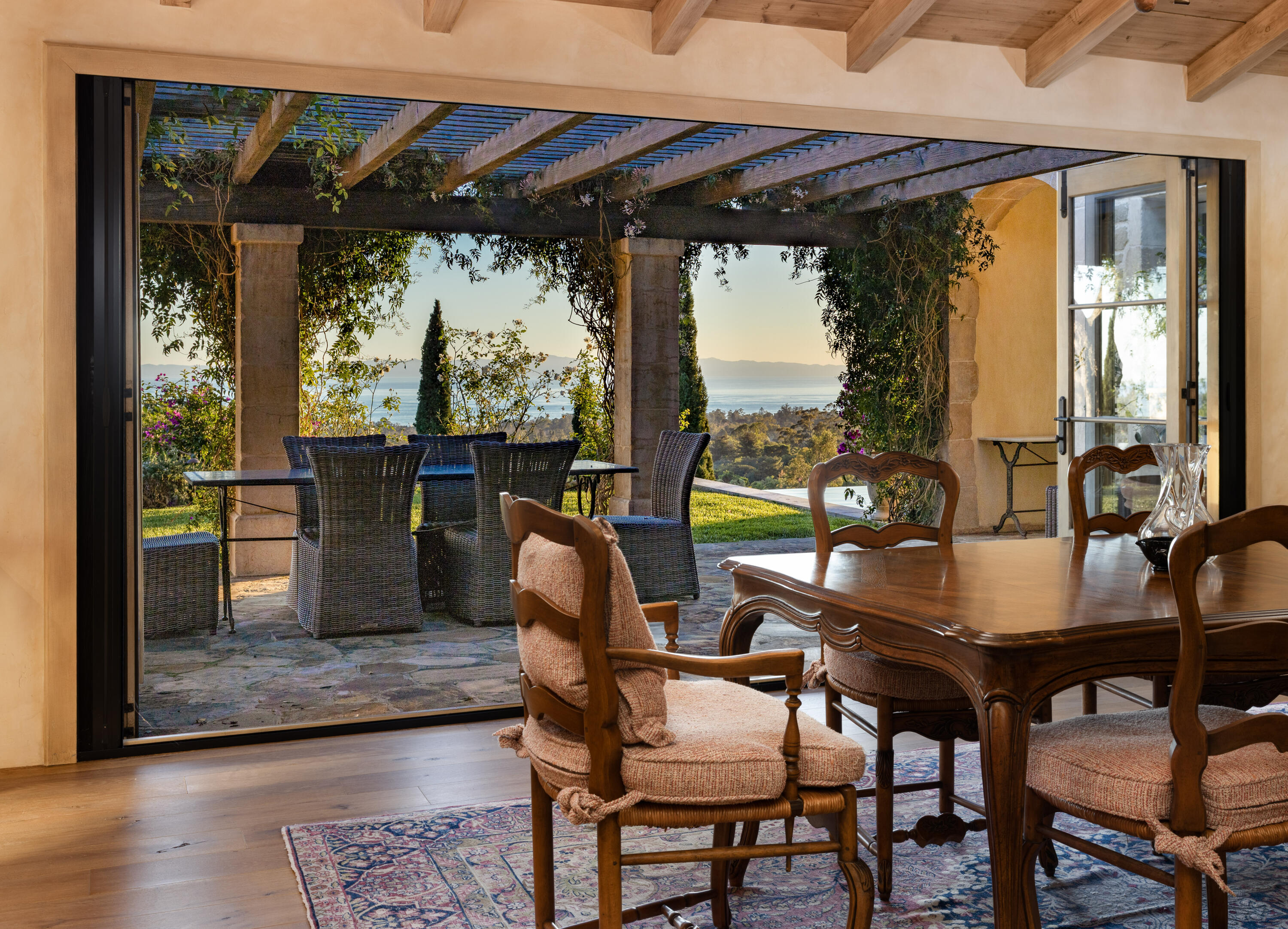 965 Brooktree Road Montecito, CA 93108 - Photo 8 of 26 a view of a dining room with furniture large windows and wooden floor