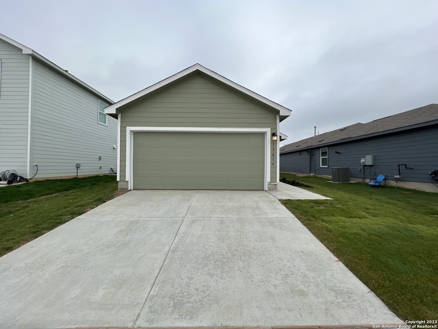 13819 Llama Place San Antonio, TX 78252 - Photo 5 of 37 a front view of house with a yard and garage