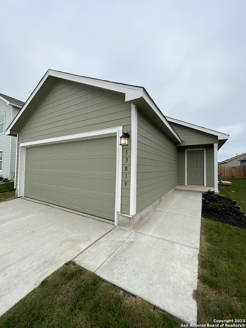 13819 Llama Place San Antonio, TX 78252 - Photo 7 of 37 a house with yard