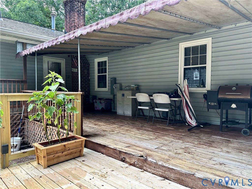 7817 Woodbrook Road Quinton, VA 23141 - Photo 23 of 28 Expansive wood deck with an overhead awning