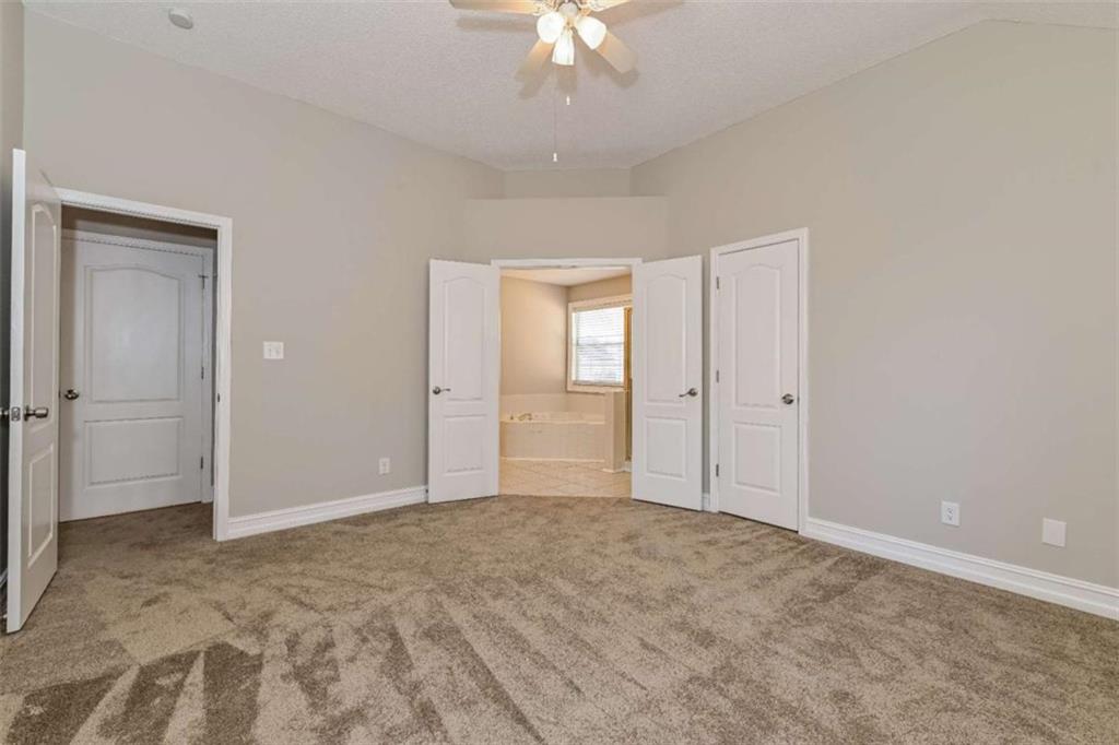 106 Emerald Lane Hampton, GA 30228 - Photo 17 of 19 a view of an empty room and chandelier fan