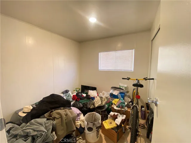 a bathroom with a granite countertop sink a mirror and a bathtub