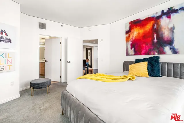 a bedroom with a bed and window