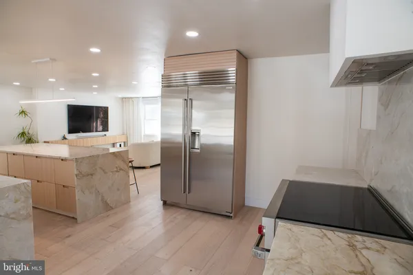 a bathroom with a sink a mirror and a shower