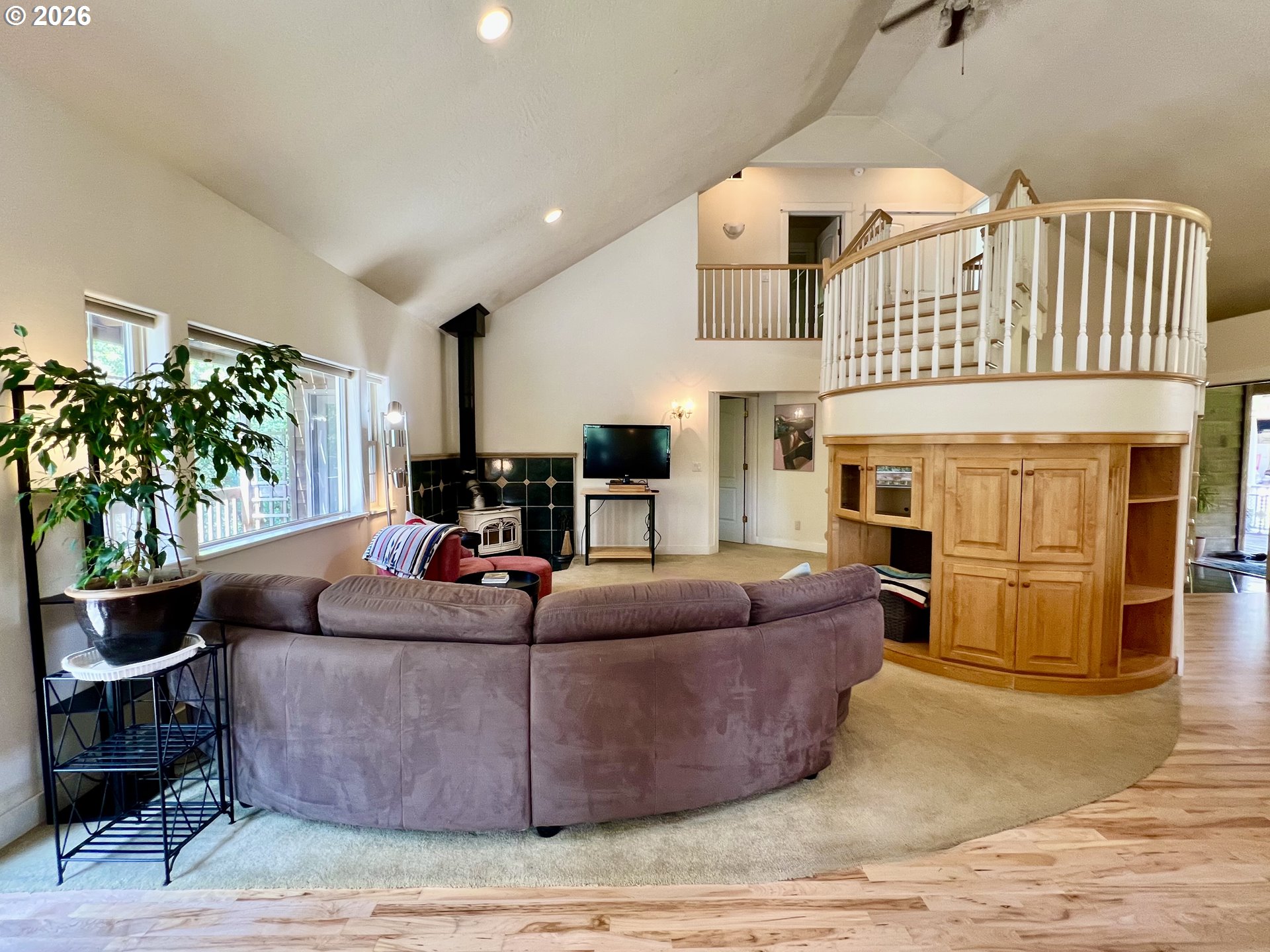 28544 Crow Road Eugene, OR 97402 - Photo 12 of 48 a living room with furniture a fireplace and a potted plant