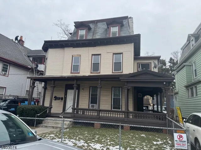 front view of a house with a small yard