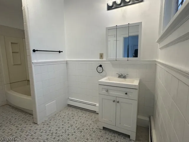 a bathroom with a sink a toilet and vanity