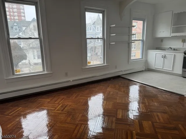 a view of an empty room with windows