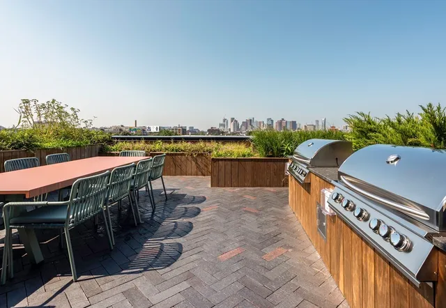 a view of a lake with boats and trees in the background