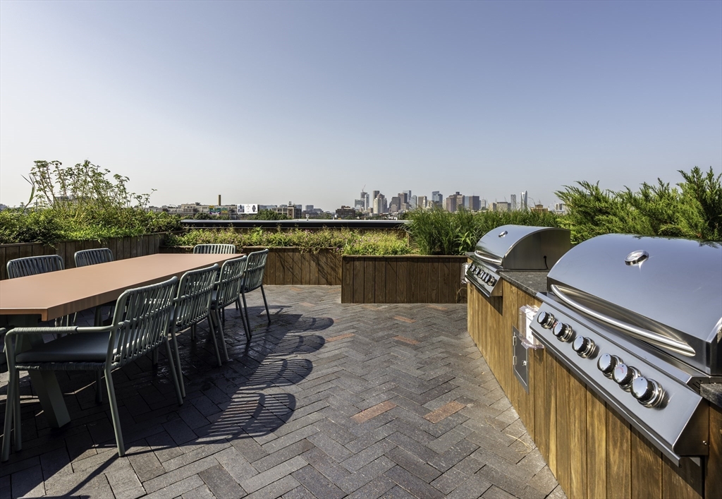 282 Bremen Street, Unit 237 Boston, MA 02128 - Photo 12 of 21 a view of a balcony with chairs