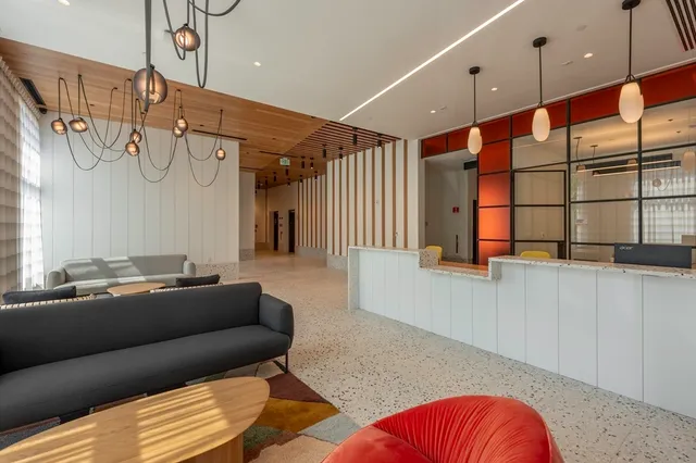 a view of a chairs and table in the balcony