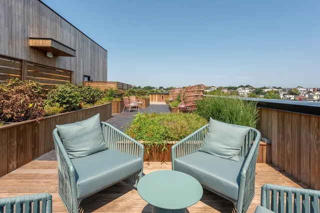 a view of balcony with furniture