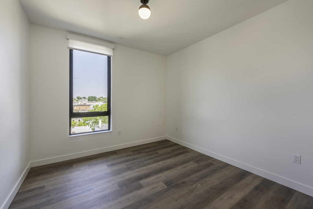 282 Bremen Street, Unit 237 Boston, MA 02128 - Photo 4 of 21 an empty room with a window