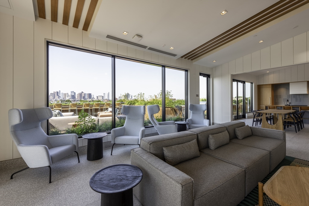 282 Bremen Street, Unit 237 Boston, MA 02128 - Photo 9 of 21 a living room with furniture and a large window
