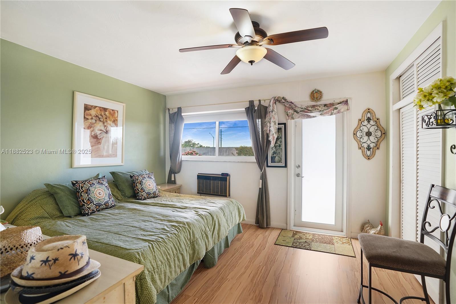 1000 Southwest 11th Avenue, Unit 17E Hallandale Beach, FL 33009 - Photo 12 of 18 a bedroom with a bed a couch and a window