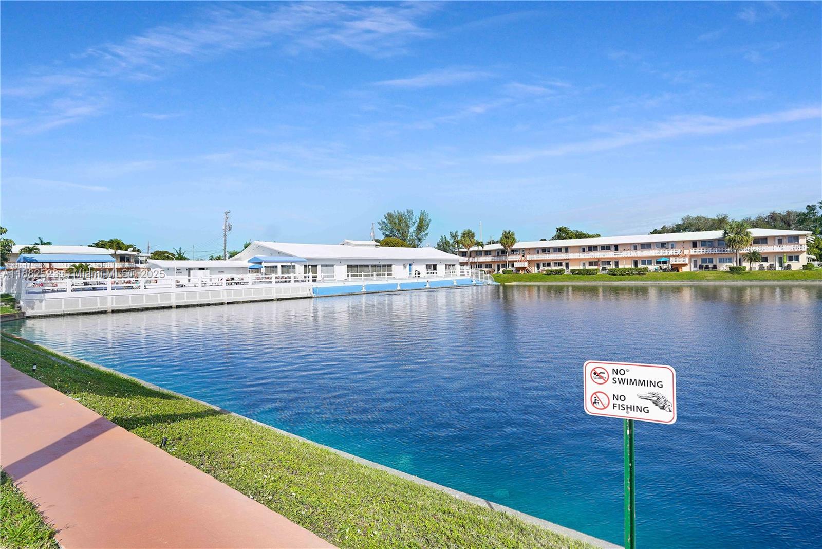 1000 Southwest 11th Avenue, Unit 17E Hallandale Beach, FL 33009 - Photo 18 of 18 a view of a lake with houses
