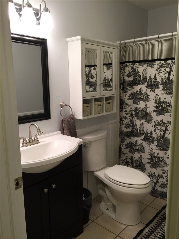 1822 Tinkling Spring Road Staunton, VA 24401 - Photo 27 of 49 a bathroom with a sink toilet and shower