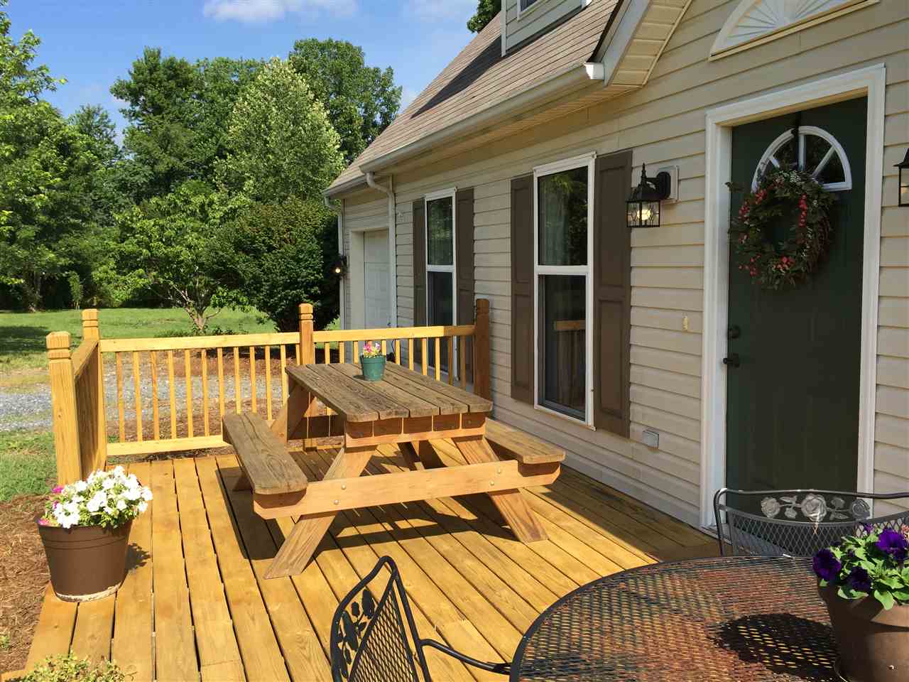 1822 Tinkling Spring Road Staunton, VA 24401 - Photo 3 of 49 a view of a patio with couches chairs and potted plants