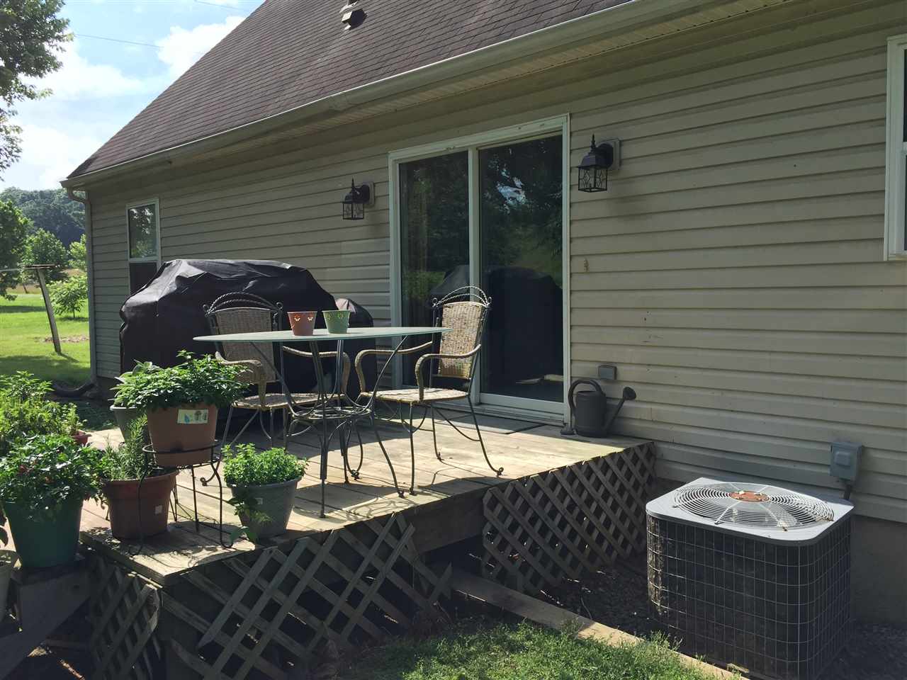 1822 Tinkling Spring Road Staunton, VA 24401 - Photo 9 of 49 a view of a patio with table and chairs and potted plants