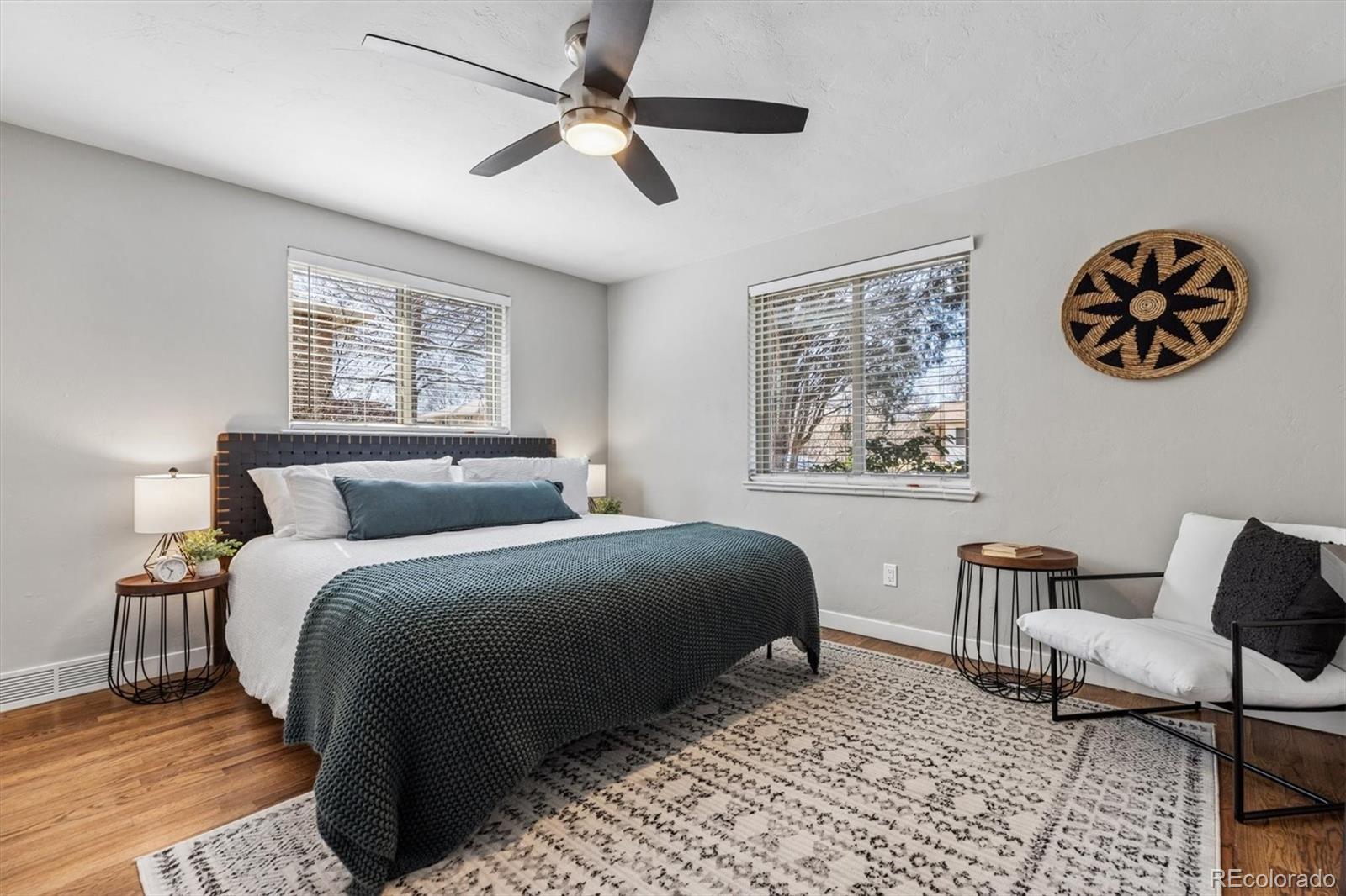 4170 North Lamar Street Wheat Ridge, CO 80033 - Photo 13 of 26 a bedroom with bed and painting on the wall
