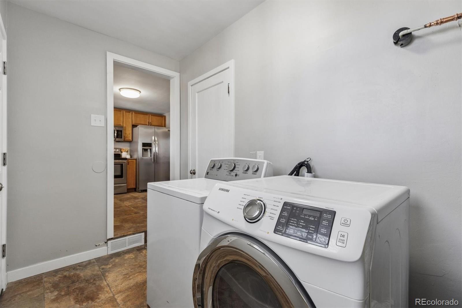 4170 North Lamar Street Wheat Ridge, CO 80033 - Photo 15 of 26 a utility room with dryer and washer