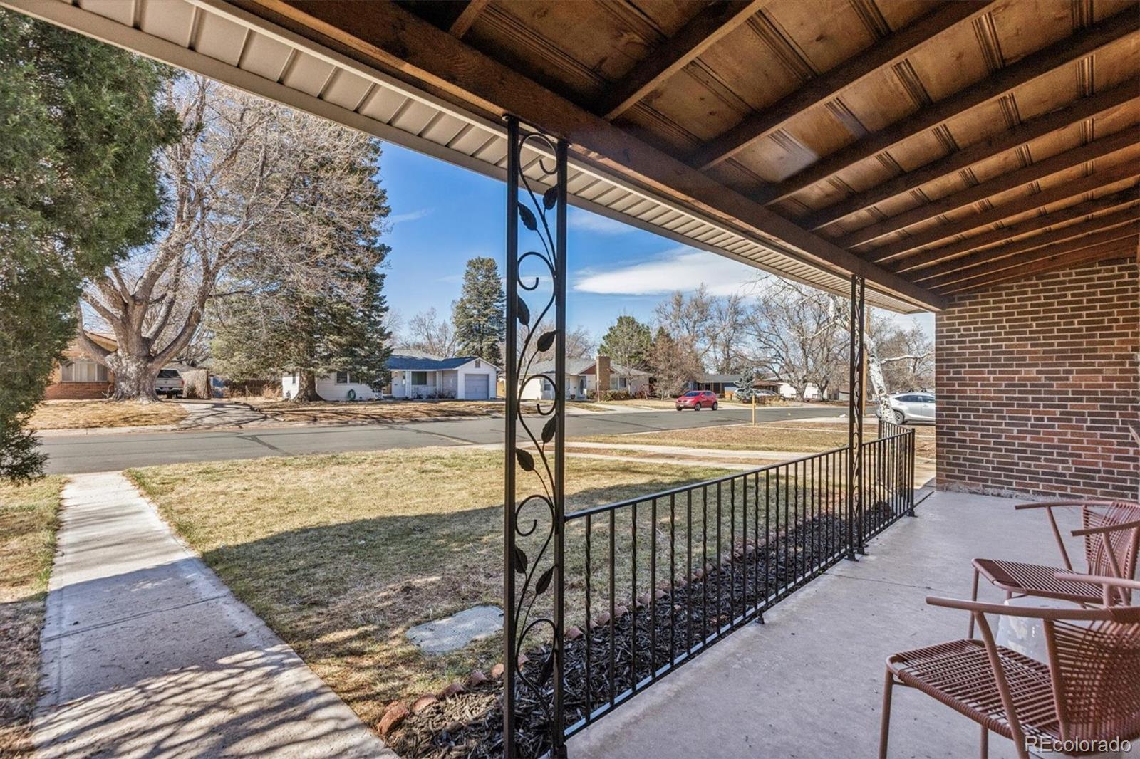 4170 North Lamar Street Wheat Ridge, CO 80033 - Photo 2 of 26 a view of a pathway of a building with wooden floor
