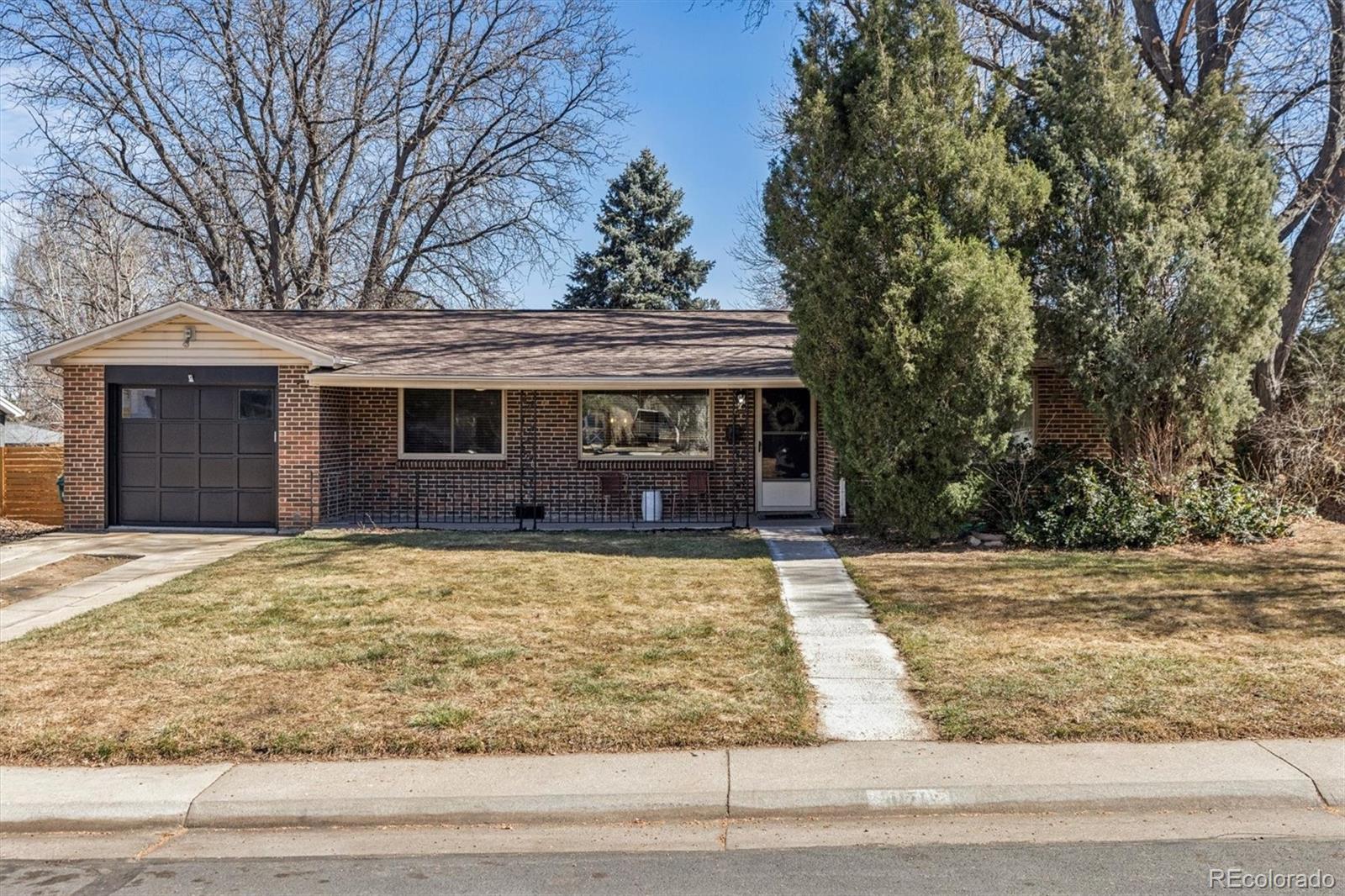 4170 North Lamar Street Wheat Ridge, CO 80033 - Photo 25 of 26 a front view of a house with yard