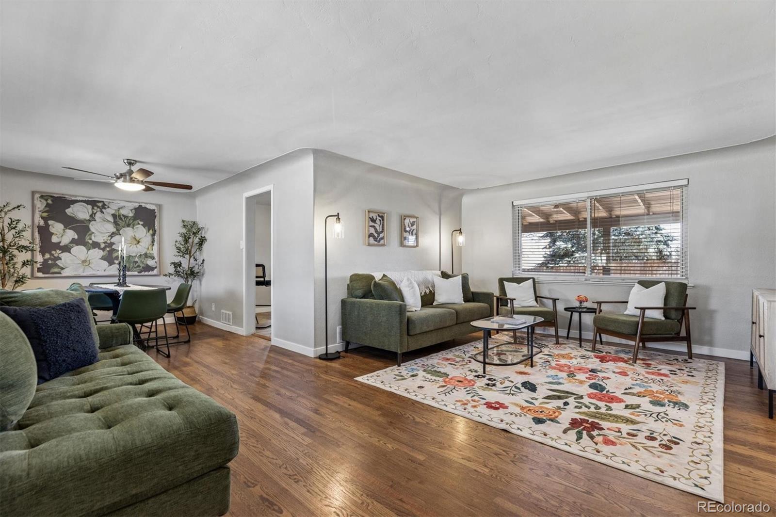 4170 North Lamar Street Wheat Ridge, CO 80033 - Photo 4 of 26 a living room with furniture and a large window