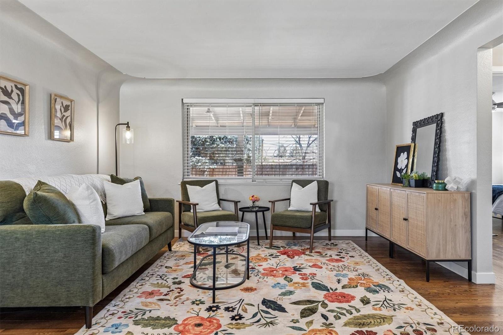4170 North Lamar Street Wheat Ridge, CO 80033 - Photo 5 of 26 a living room with furniture and a rug