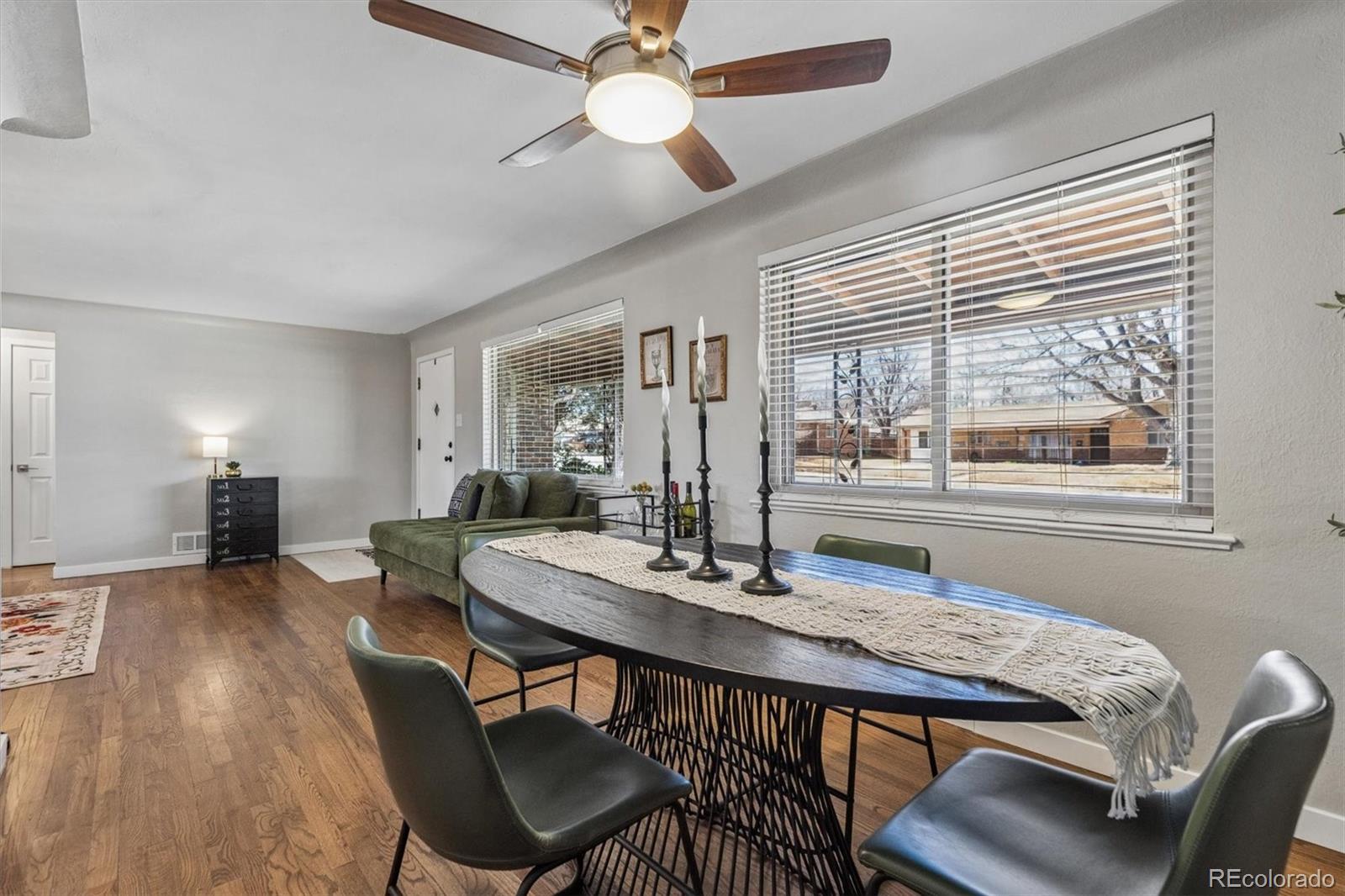 4170 North Lamar Street Wheat Ridge, CO 80033 - Photo 7 of 26 a view of a dining room with furniture window and wooden floor
