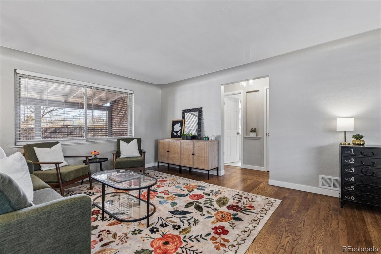 4170 North Lamar Street Wheat Ridge, CO 80033 - Photo 8 of 26 a living room with furniture and a rug
