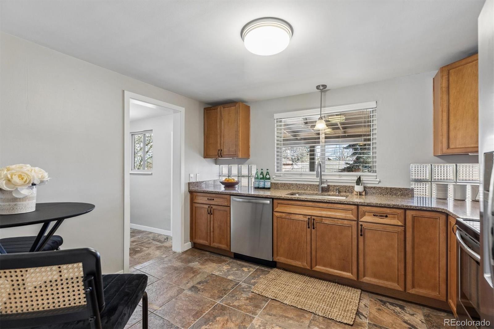 4170 North Lamar Street Wheat Ridge, CO 80033 - Photo 10 of 26 a kitchen with sink and window