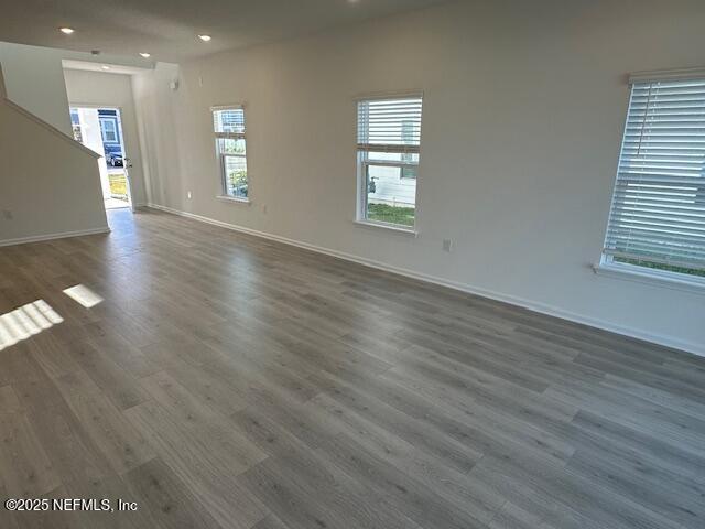 57 Camphor Laurel Road St. Augustine, FL 32092 - Photo 12 of 34 an empty room with wooden floor and windows