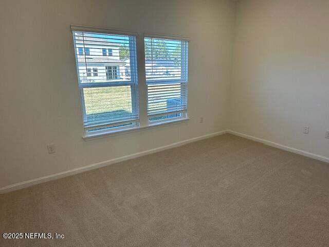 57 Camphor Laurel Road St. Augustine, FL 32092 - Photo 14 of 34 an empty room with a window