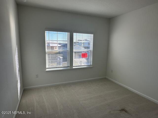 57 Camphor Laurel Road St. Augustine, FL 32092 - Photo 19 of 34 a view of an empty room with a window
