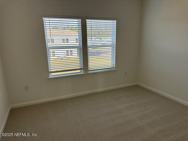 57 Camphor Laurel Road St. Augustine, FL 32092 - Photo 25 of 34 an empty room with a window