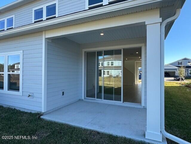 57 Camphor Laurel Road St. Augustine, FL 32092 - Photo 3 of 34 front view of a house with a yard