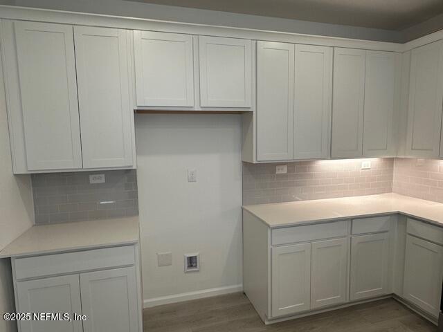 57 Camphor Laurel Road St. Augustine, FL 32092 - Photo 6 of 34 a kitchen with white cabinets and a sink