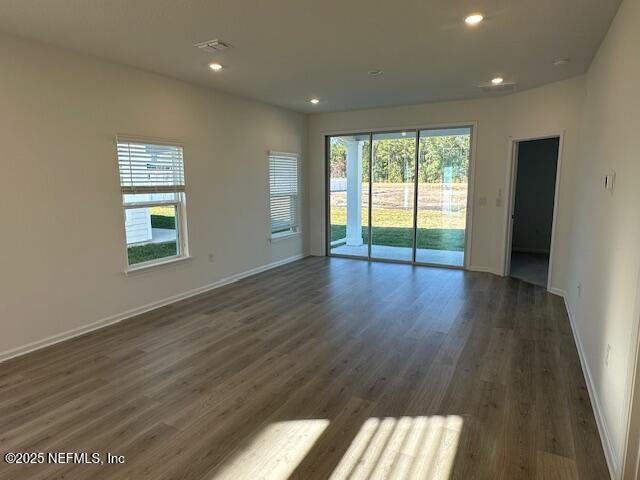 57 Camphor Laurel Road St. Augustine, FL 32092 - Photo 10 of 34 a view of an empty room with wooden floor and a window