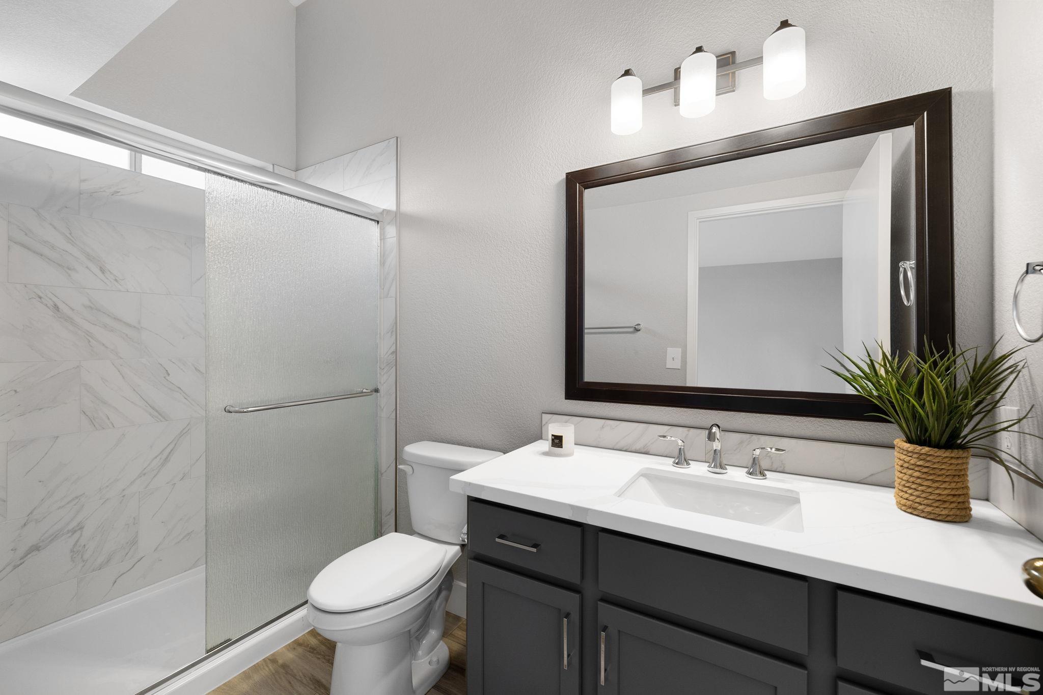 7577 Water View Way Reno, NV 89511 - Photo 14 of 20 a bathroom with a sink toilet and shower