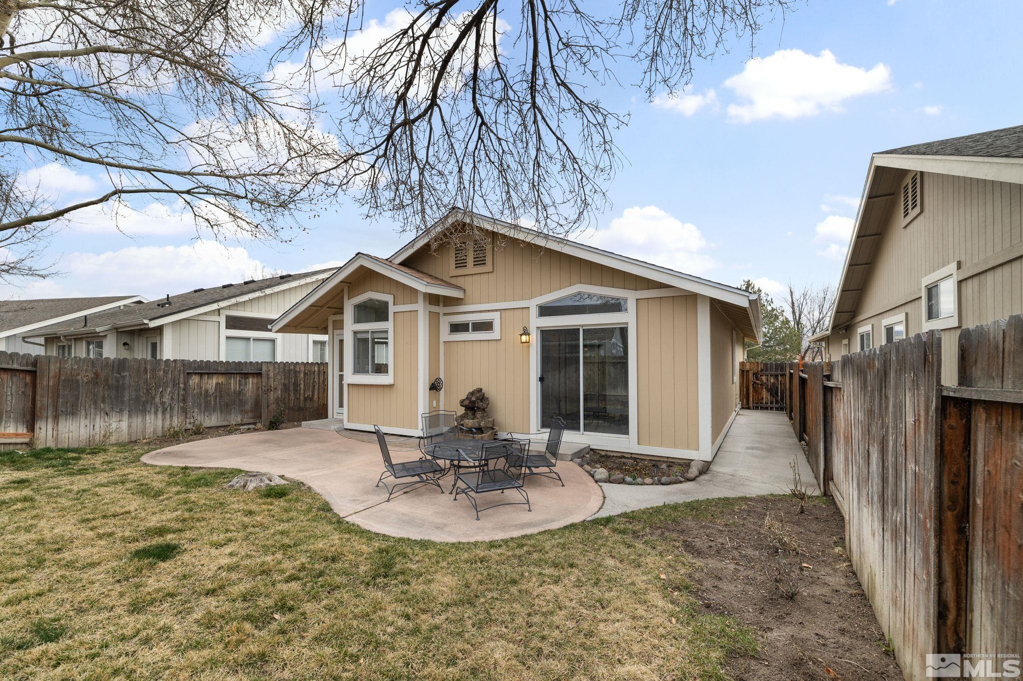 7577 Water View Way Reno, NV 89511 - Photo 20 of 20 a front view of a house with a yard outdoor seating and garage