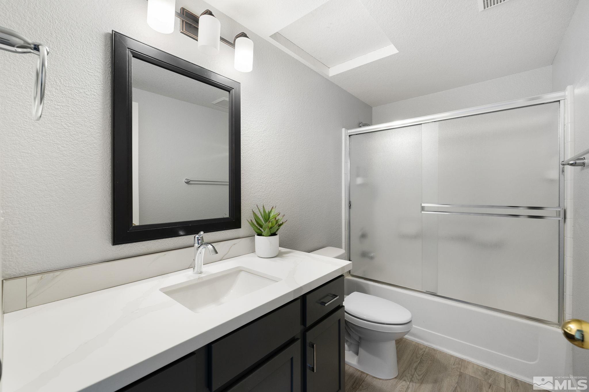 7577 Water View Way Reno, NV 89511 - Photo 10 of 20 a bathroom with a sink a toilet and shower