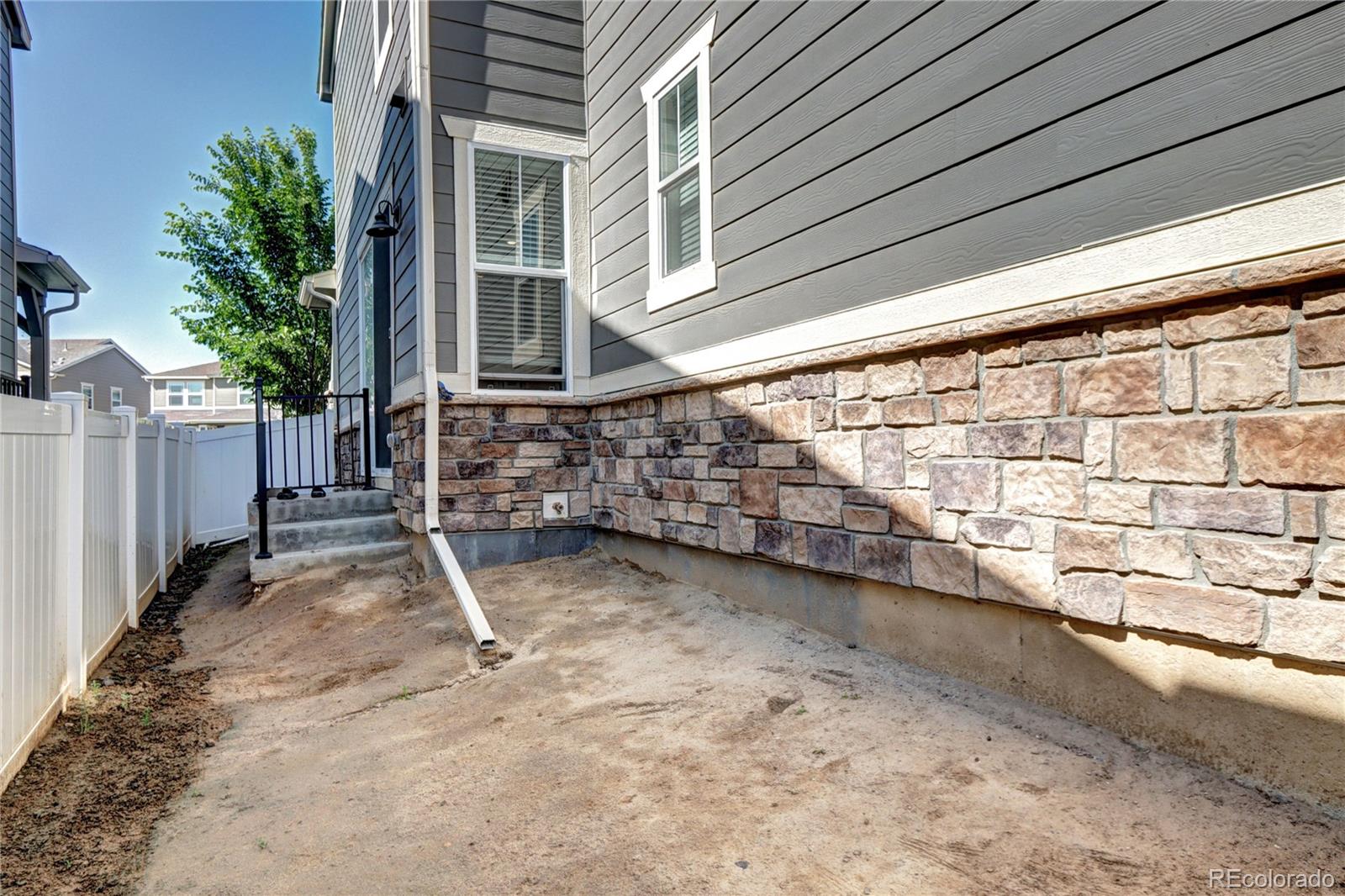 952 Morning Glory Road Brighton, CO 80640 - Photo 16 of 21 a view of a backyard with wooden fence