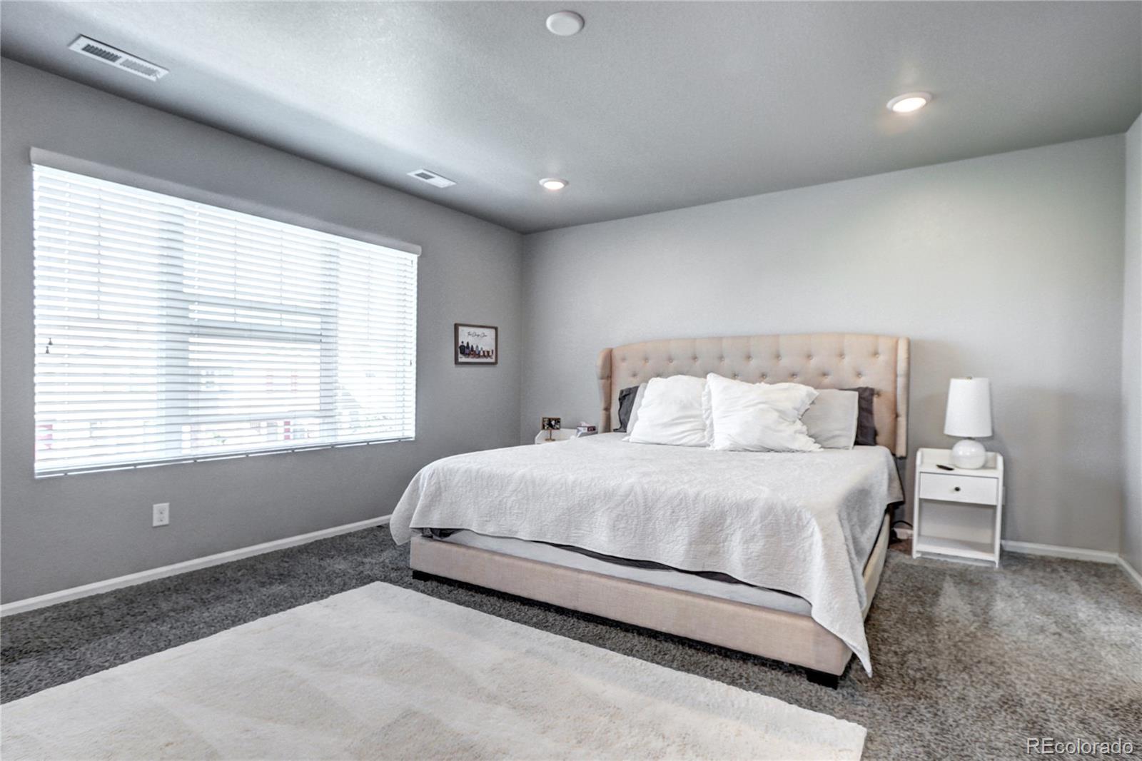 952 Morning Glory Road Brighton, CO 80640 - Photo 9 of 21 a bedroom with a bed and a window