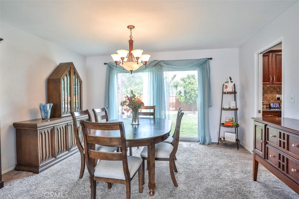 321 Blossom Place Brea, CA 92821 - Photo 12 of 50 a view of a dining room with furniture window and wooden floor