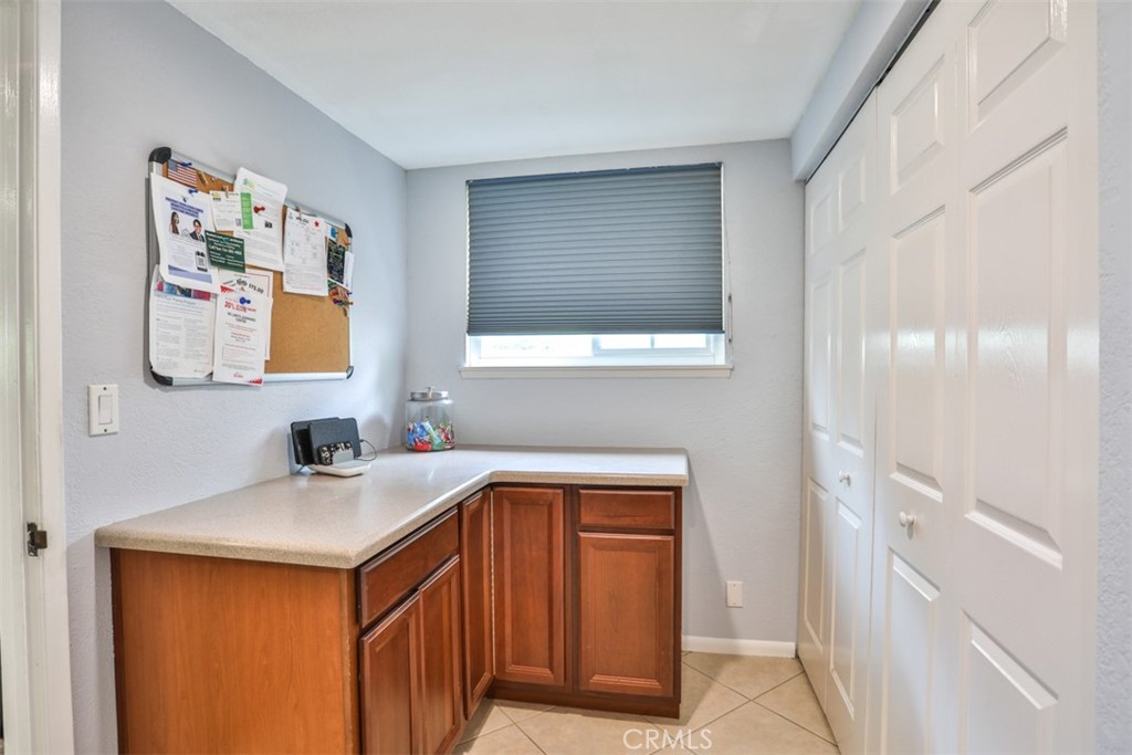321 Blossom Place Brea, CA 92821 - Photo 20 of 48 a utility room with a sink a mirror and cabinets