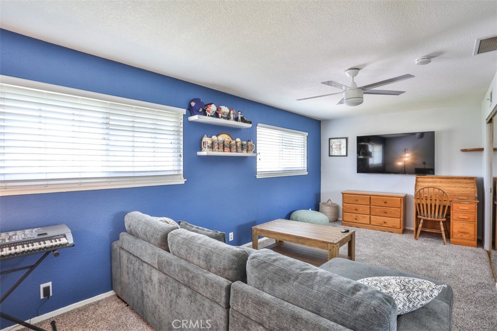 321 Blossom Place Brea, CA 92821 - Photo 29 of 48 a living room with furniture and a flat screen tv
