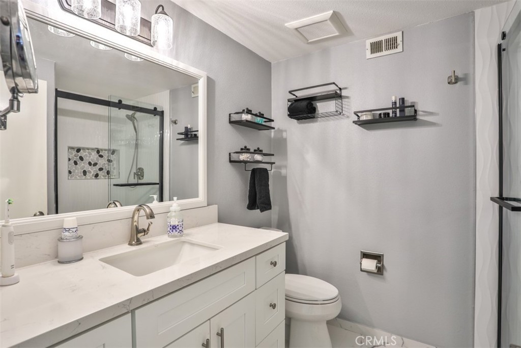 321 Blossom Place Brea, CA 92821 - Photo 30 of 50 a bathroom with a sink toilet and shower