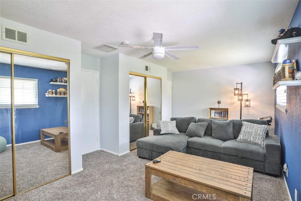 321 Blossom Place Brea, CA 92821 - Photo 32 of 48 a living room with furniture and a chandelier