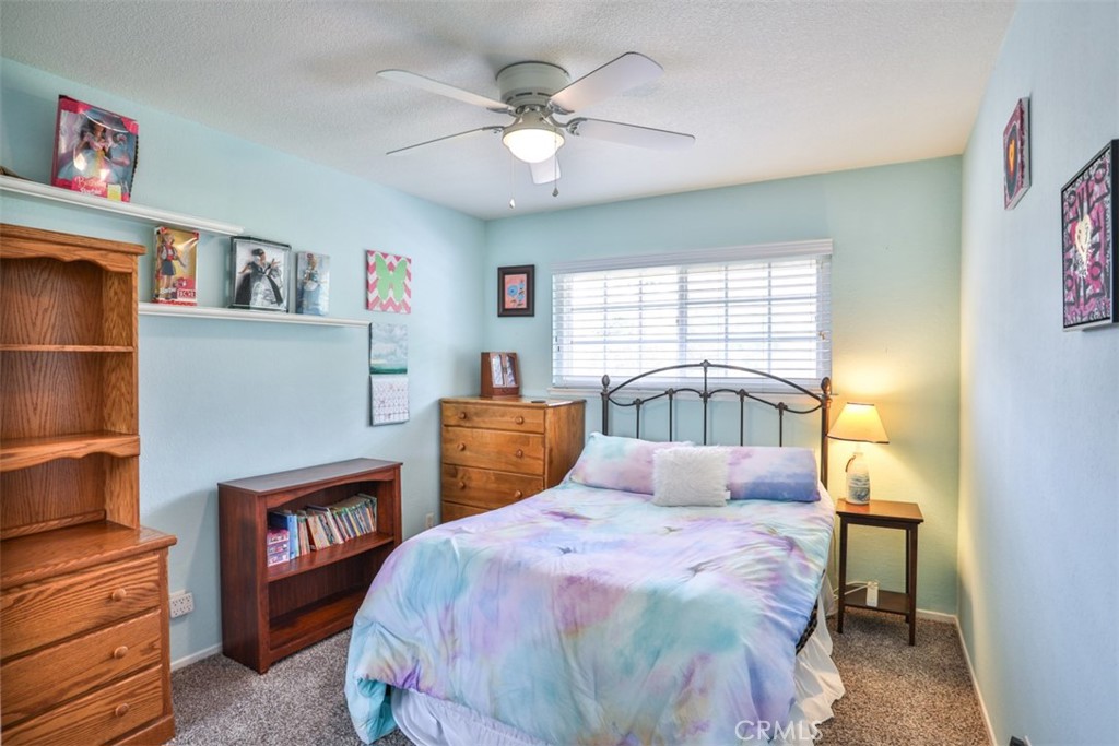 321 Blossom Place Brea, CA 92821 - Photo 33 of 48 a bedroom with a bed and a chandelier